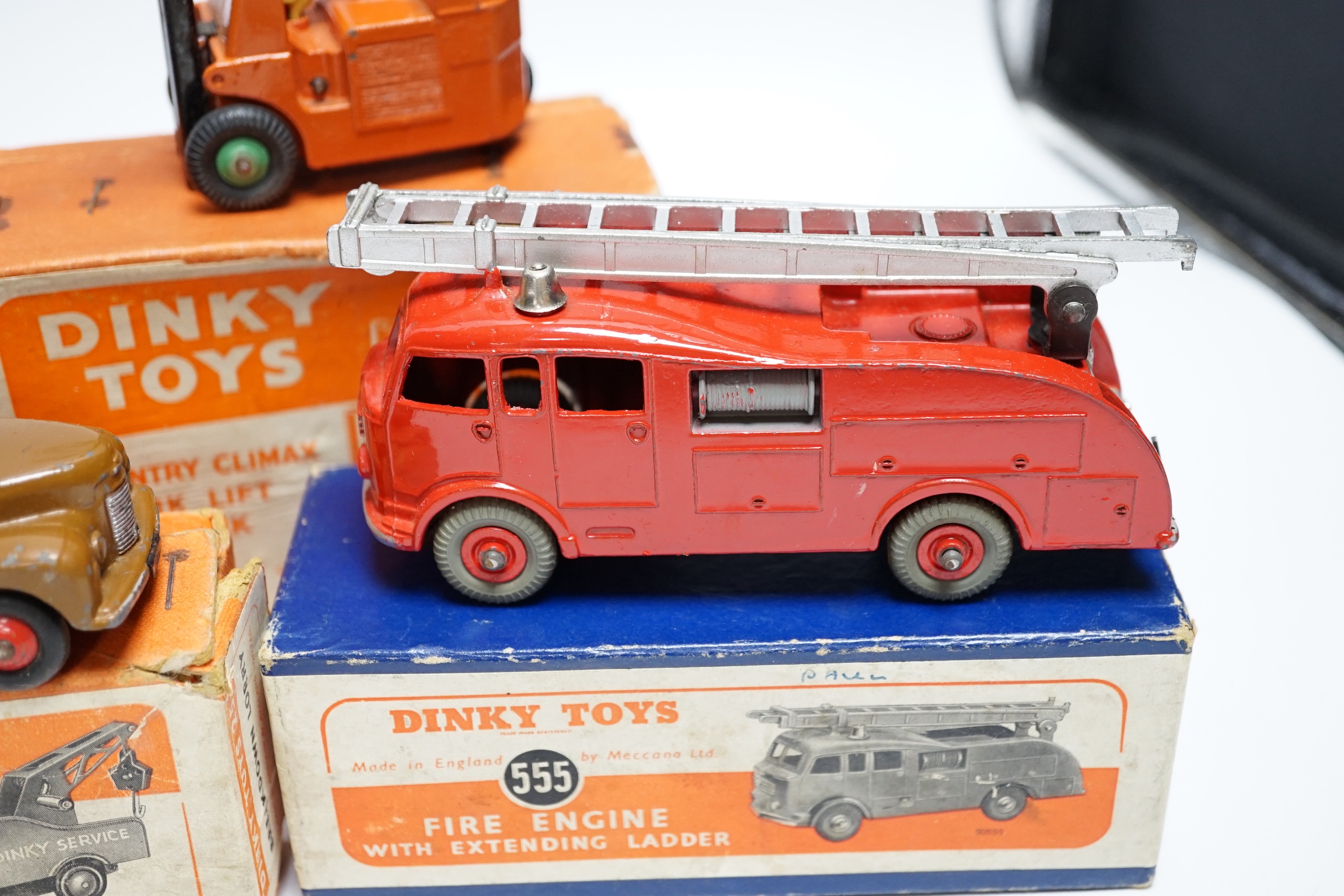 Five boxed dinky toys including (25x) breakdown lorry, (410) Bedford End Tipper, (555) Fire Engine, (571) Coles Mobile Crane, and (14c) Coventry Climax Fork Lift Truck